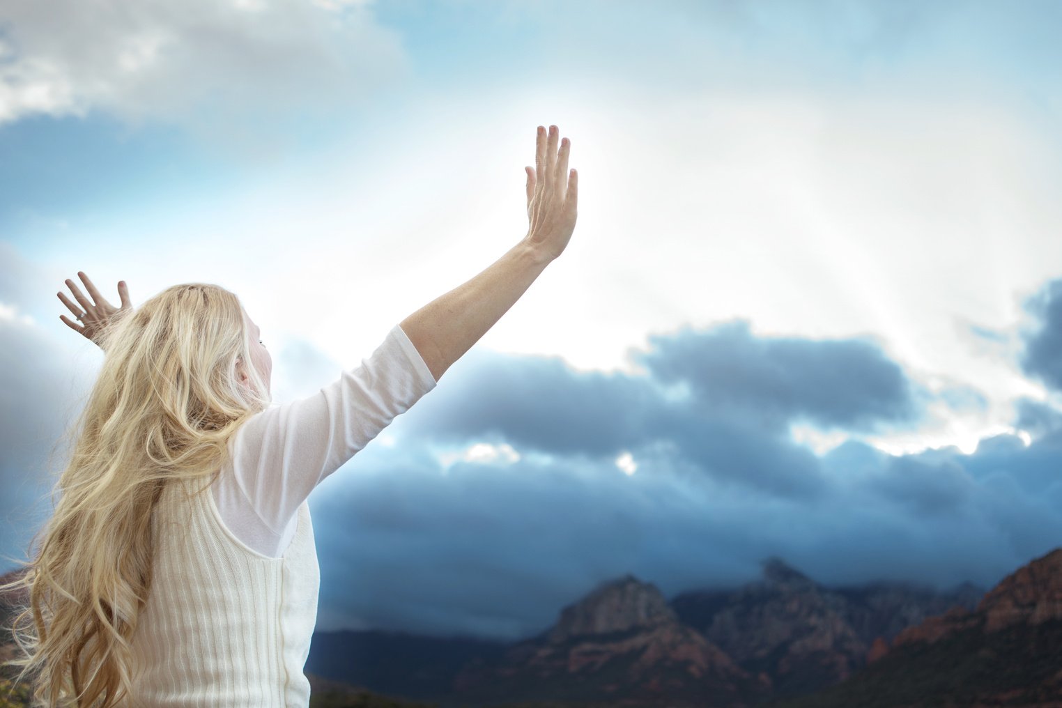 Beautiful Happy Blonde Woman Looking at Sky