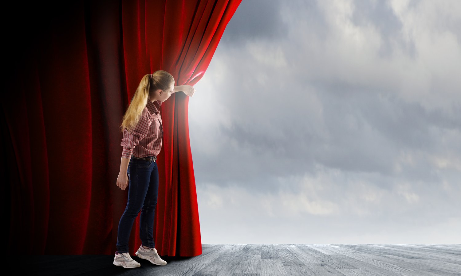 Girl opening curtain